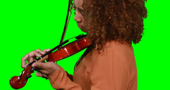 Close-up of female musician playing violin