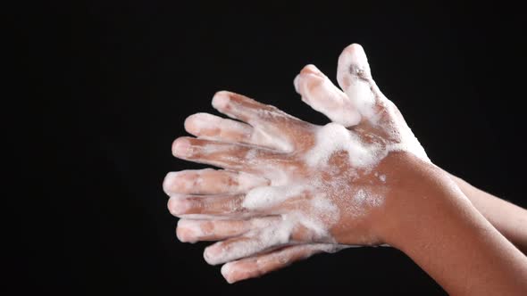 Child Boxy Washing Hands with Soap Isolated on Black