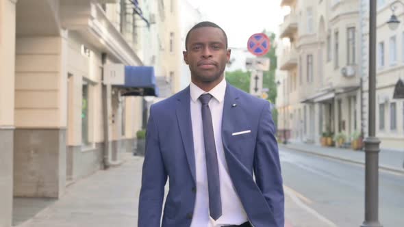 African Businessman Walking on Street Slow Motion