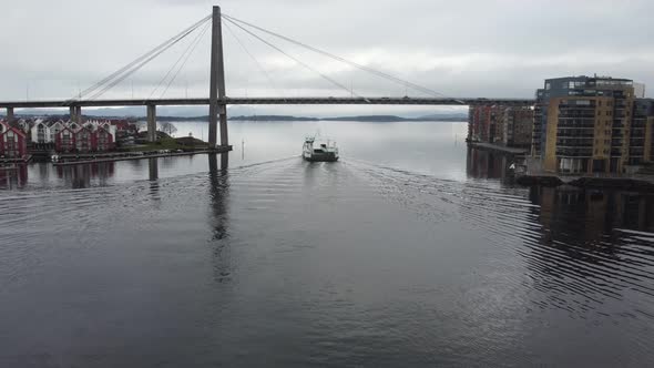 Ferry Ryberbuen is passing under Stavanger city bridge bybrua - Norway aerial