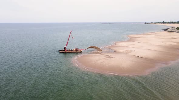 Lake Michigan's coast being repaired after water rising.