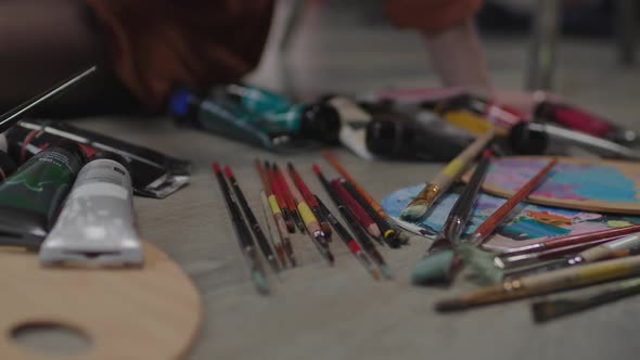 Artistic Tools and Accessories on Table in Art Studio