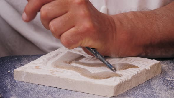 Craftsman Making Stone Fresco Closeup