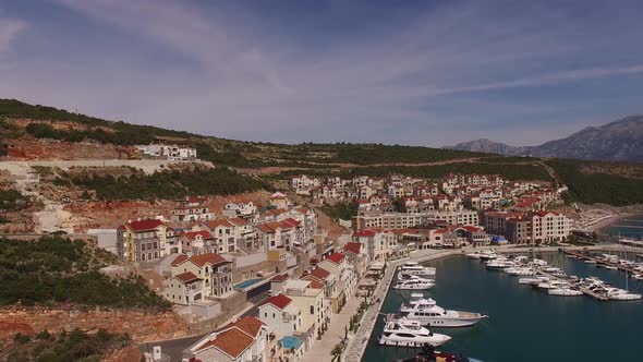 Roofs of Houses on the Embankment of Marina Village with Moored Yachts