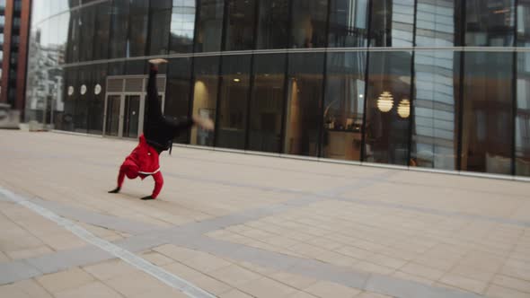 Man Performing Parkour Tricks Outdoors in the City