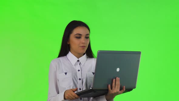 Beautiful Businesswoman Video Chatting on Her Laptop