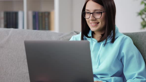 Young Woman Having Video Conference on Laptop