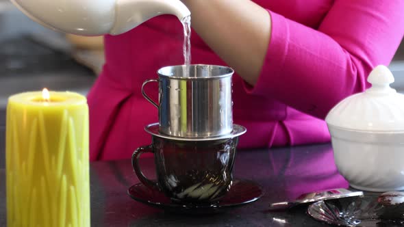 Woman Prepares Traditional Vietnamese Coffee