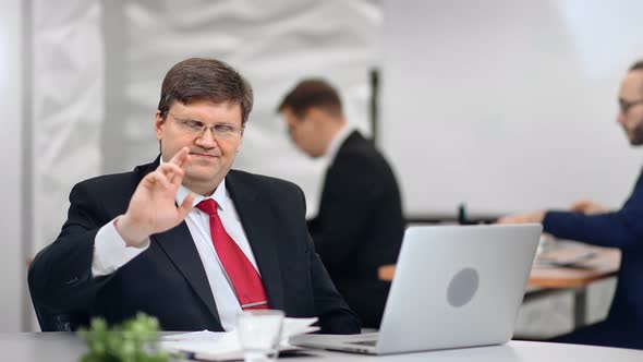 Annoyed Male Boss in Suit Showing Gesture Reject Saying No at Office Routine Background