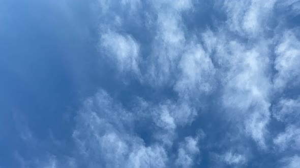 Time-lapse of a Deep Blue Sky with White Whispy Clouds