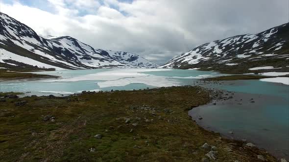 Frozen lake in mountain pass in Norway