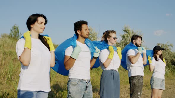 Multiethnic Volunteers on the Beach Side Posing