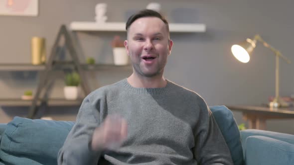 Portrait of Casual Man Talking on Video Call