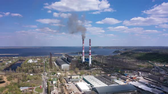 Coal-fired Smokestack Releasing Black Smoke into the air. Environmental pollution 4K aerial