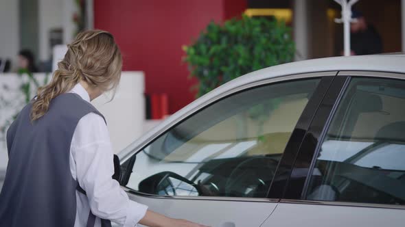 Joyful and Emotional Woman in a Car Dealership