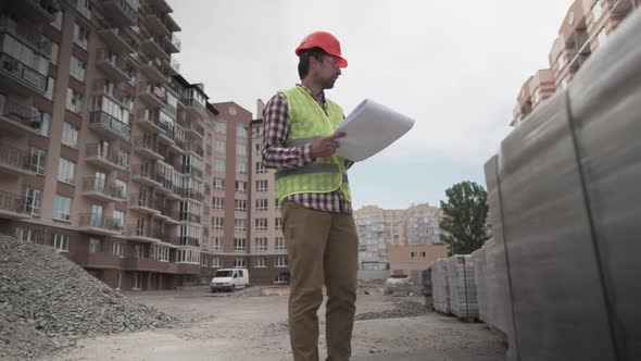 A Male Construction Manager Checks the Quantity and Checks the Construction Matral with Documents at