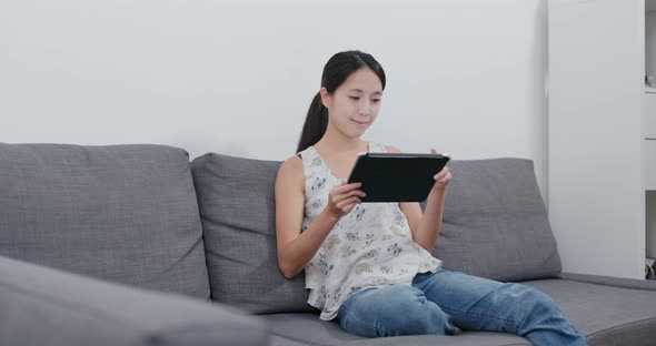 Woman use of tablet computer at home