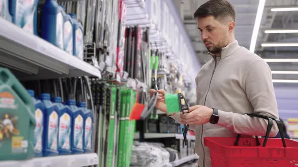 Man Shopper Buying Windscreen Brush for Car