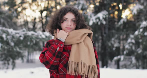 Portrait of a girl, Scenic Sunset Snow-Covered Forest In Winter Season, Christmas Background