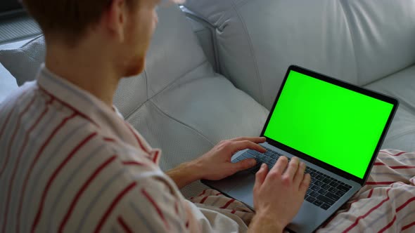 Guy Talking Chroma Key Laptop on Weekend Closeup