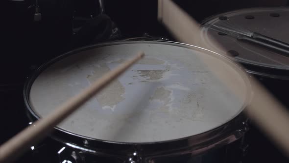 the Drummer Plays with Sticks on a Snare Drum, Home Lesson Training.