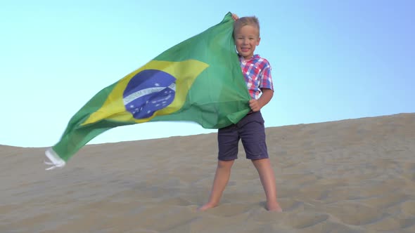 Child with Brazilian Flag the Beach