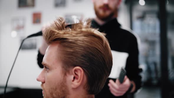 Drying and Styling of Men's Hair. Slow Motion