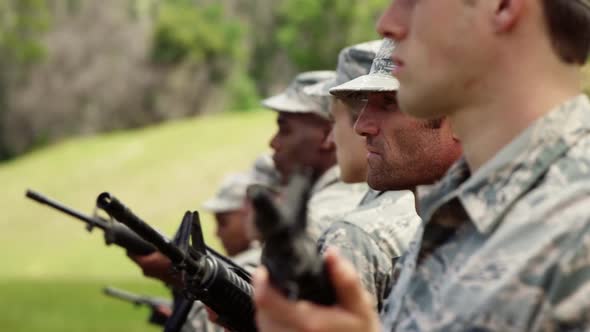 Group of military soldiers standing with rifles 4k