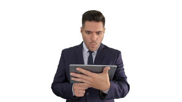 Shocked Businessman Watching Something on Digital Tablet