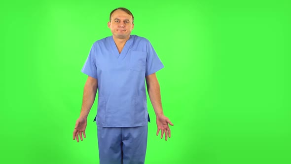 Medical Man Shrugs and Shakes Her Head Negatively, Green Screen