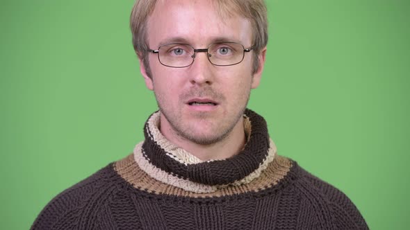 Studio Shot of Blonde Handsome Man Looking Shocked