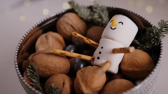 Marshmallow Snowman in a Gift Box with Nuts