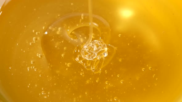 Using Spoon for Honey in Bowl, Pick It Up, Close Up, Macro