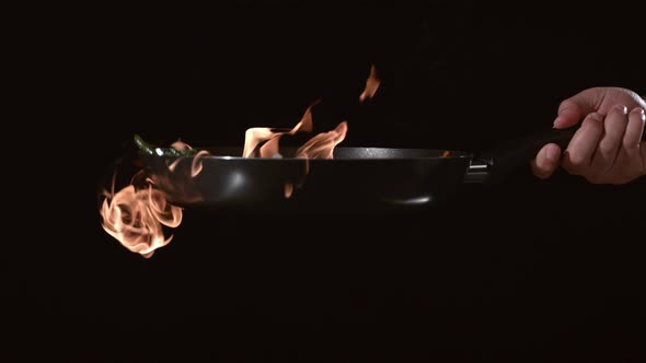 Flaming stir-fry in slow motion; shot on Phantom Flex 4K at 1000 fps alt
