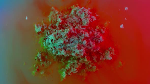 Medical Tablet Dissolving in Colorful Water Macro alt