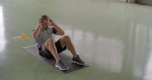 Young Adult Man Doing Situps Exercise During Fitness Sport Workout