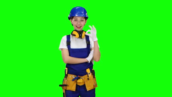 Construction Worker Girl Showing Okey, Green Screen