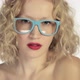Young woman wearing glasses and winking at camera - VideoHive Item for Sale