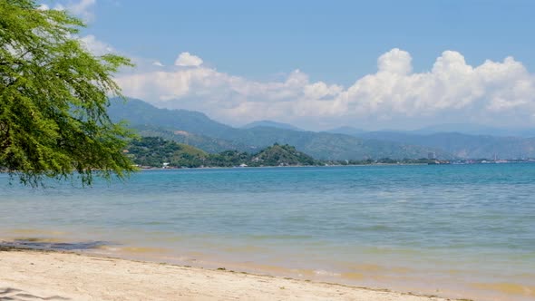 The popular tourist spot Metiaut with white sandy beach and turquoise ocean in capital Dili, Timor L