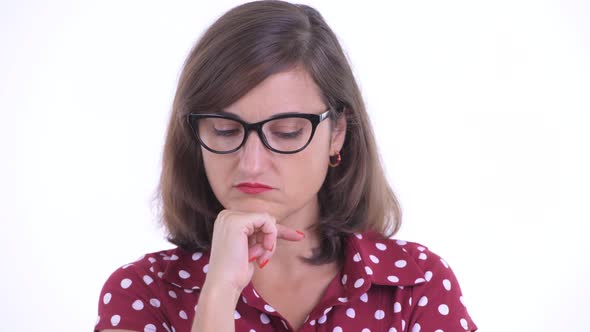 Face of Stressed Woman with Eyeglasses Thinking and Looking Down