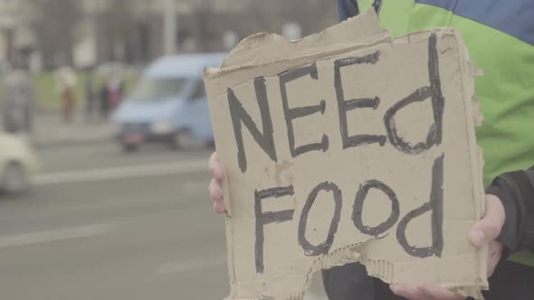 The Inscription "Need Food" By a Poor Homeless Tramp. Kyiv. Ukraine