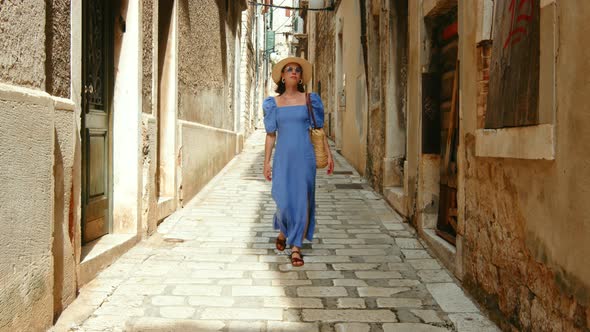 Young tourist walking along the city street