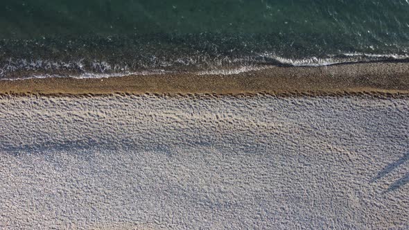 Aerial View From Above on Azure Sea and Pebbles Beach