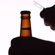 The Silhouette of Male hands opening brown beer bottle with opener - VideoHive Item for Sale