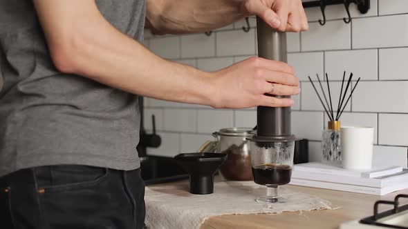 Barista Makes Aeropress Step By Step. Squeeze Out Coffee