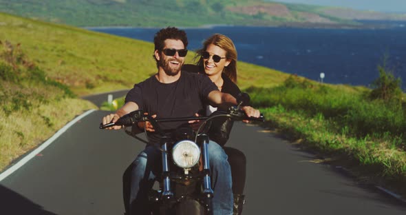 Couple Riding Vintage Motorcycle