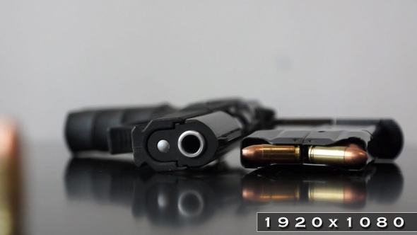 Bullet magazine and 9mm gun alt