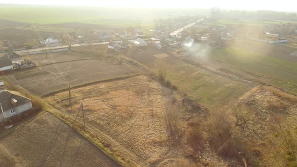 Top View of Beautiful Rural Countryside in Sunlight. Drone View of Calm Clean Ukrainian Village in