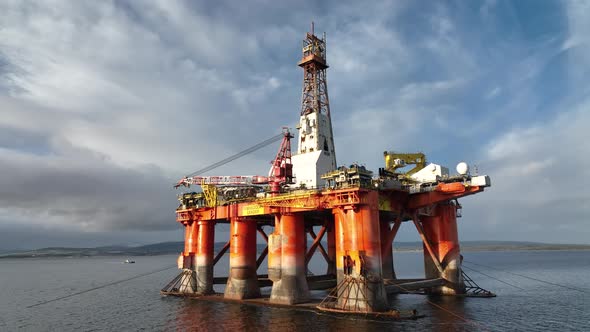 Oil and Gas Rigs Seen up Close at Sunset