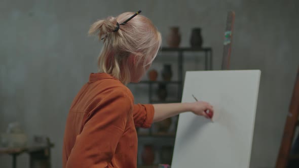 Charismatic Female Artist Creating Design of Painting